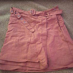 Orange skirt with buckle. Size medium.